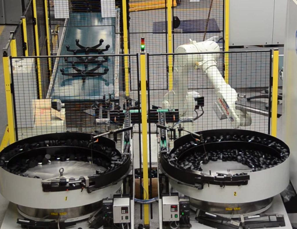 Kawasaki Robotics industrial robot working with an injection moulding machine. Source: ASTOR